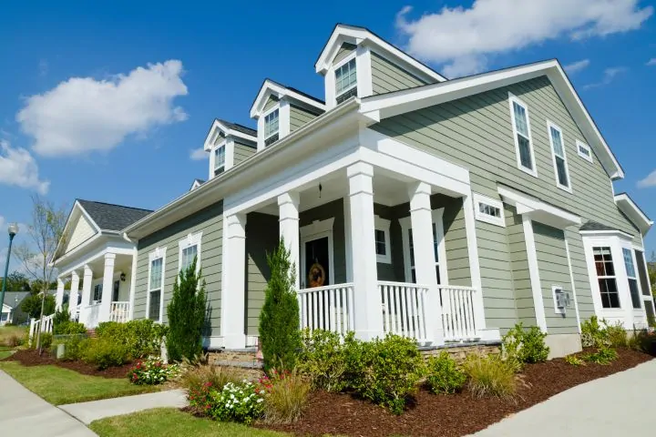 Suburban house with green hardie board on the outside