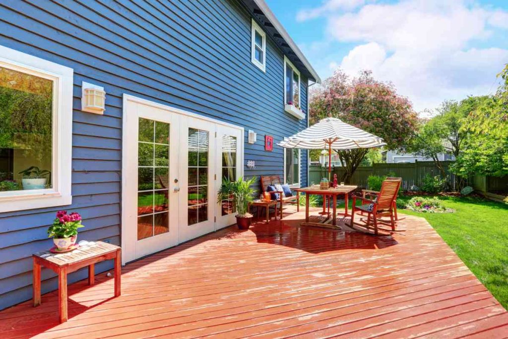 The back of a home with beautiful blue siding