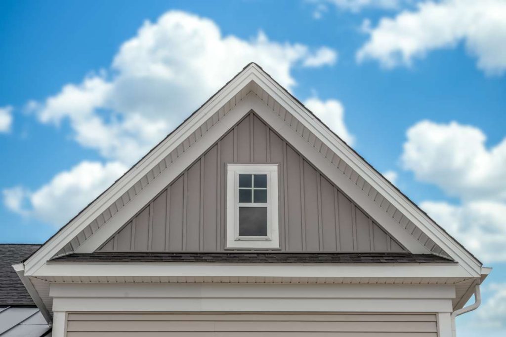 A white house with vertical siding.