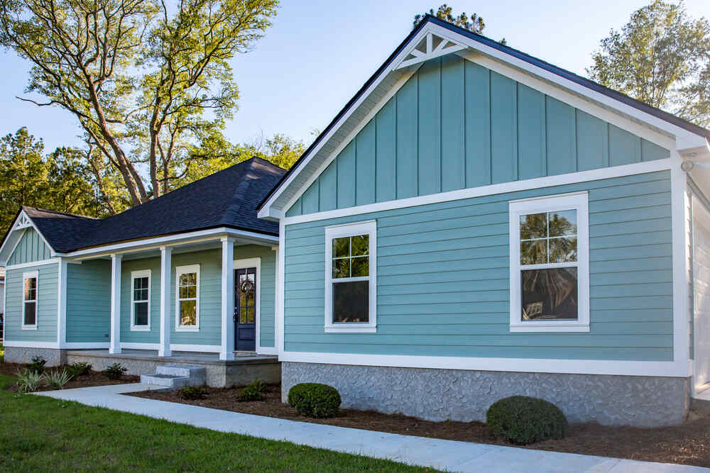 A beautiful home with blue siding