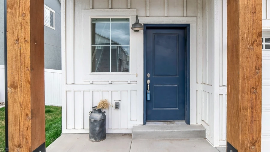 Exterior of a house with white board and batten siding