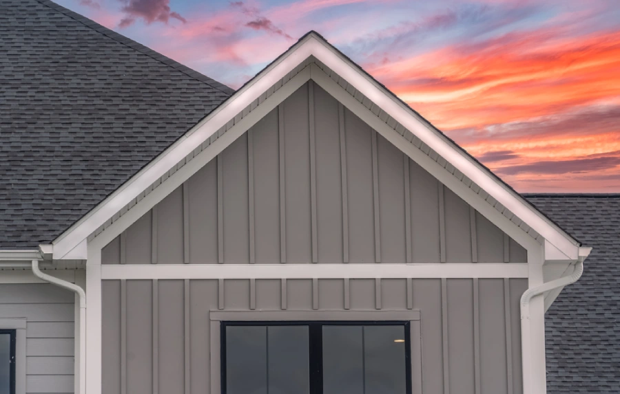 Gray board and batten siding with white trim