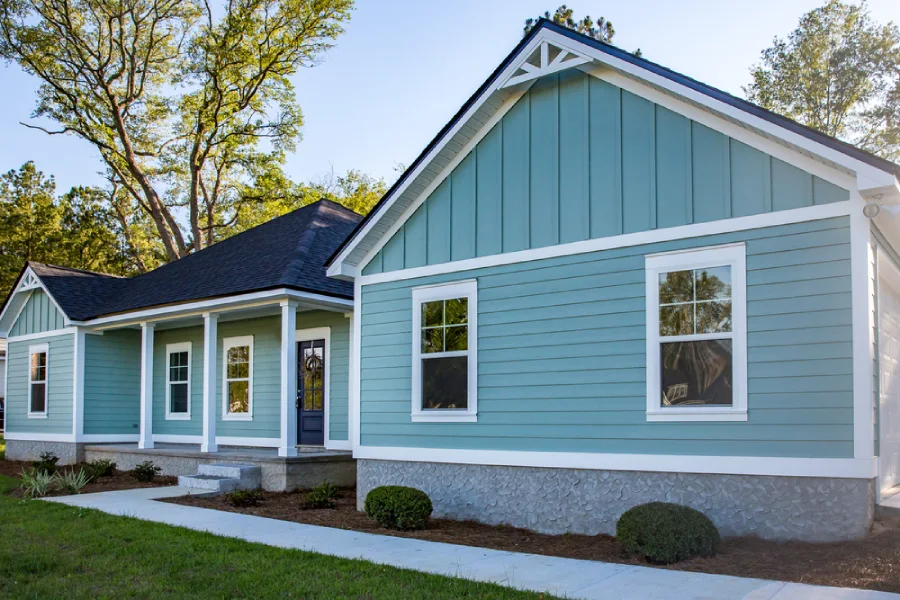 Front view of a house with blue vinyl siding