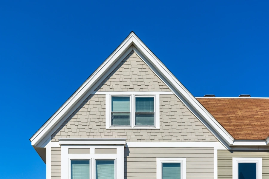 A house with gable end siding with white trim