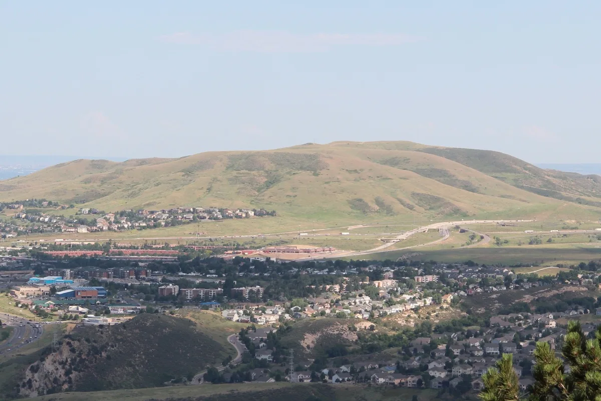 Aerial view of Lakewood, Colorado neighborhoods at dusk with the foothills in the background